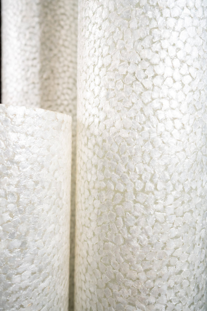 Three Illuminated Wangi White Cylinder Floor Lamps in different sizes arranged in a set. Details of the Design are shown on this image