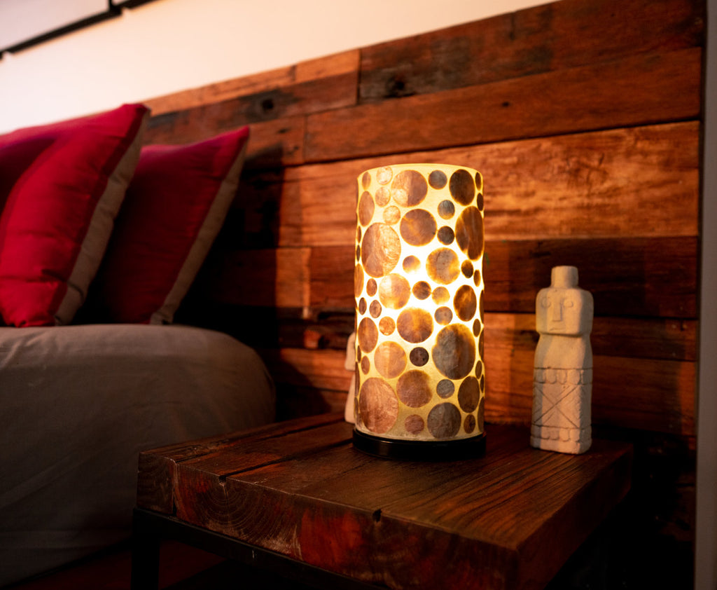 Gold Coin mini cylinder used as bedside lamp in  bedroom. This pic was taken in a Balinese Villa
