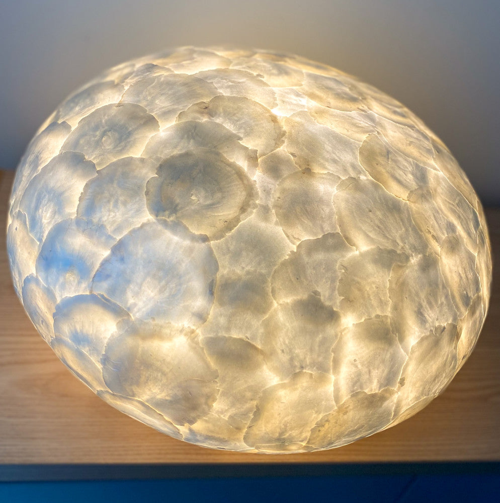 Table Lamp full shell UFO in front of a mirror. Beautiful glowing effect.