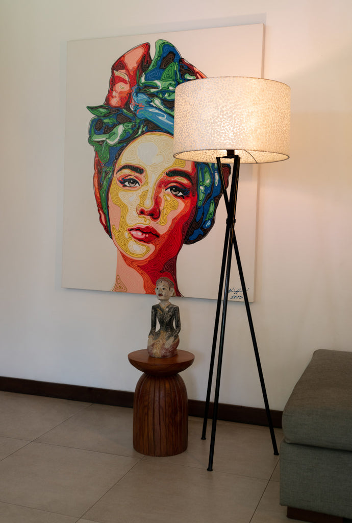 Decorative Floor Lamp with Shade (Ø55cm) "Wangi White Tripod" standing in a Bali villa next to a colorful painting