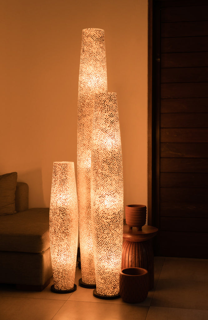 Beautiful set of different sizes of Wangi Gold Apollo Floor Lamps in a living room in a Villa in Bali