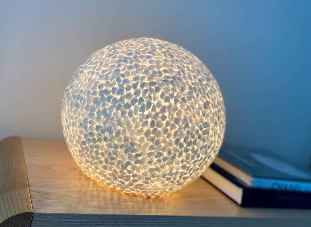 Illuminated Table / globe lamp Wangi White sphere on a cabinet in a living room