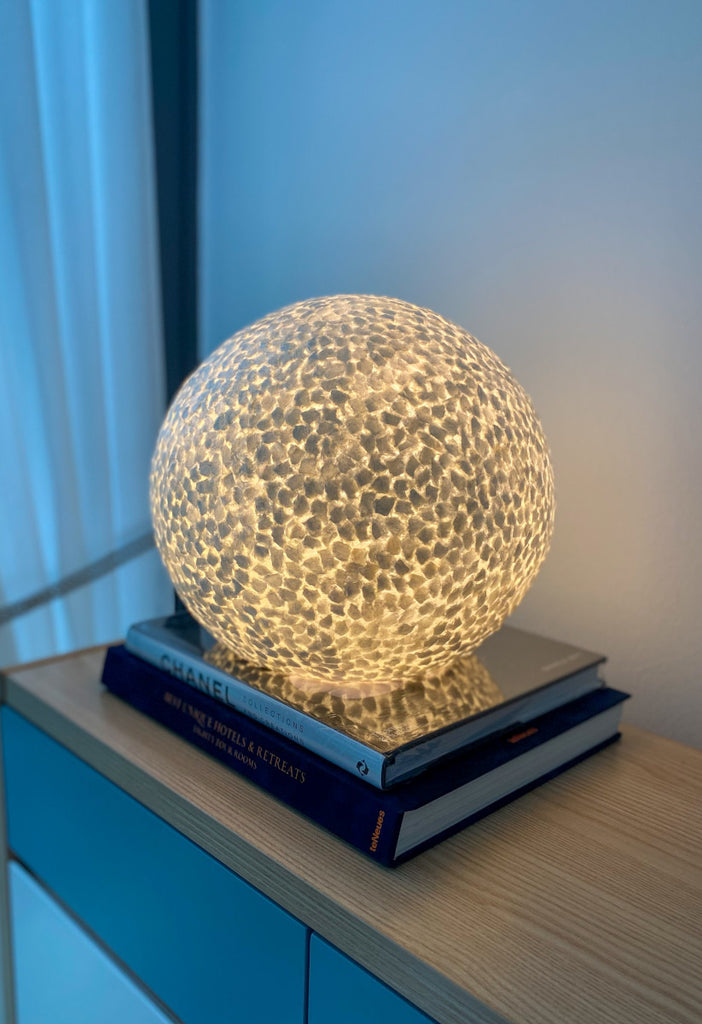 Illuminated Table / globe lamp Wangi White sphere on a cabinet in a living room