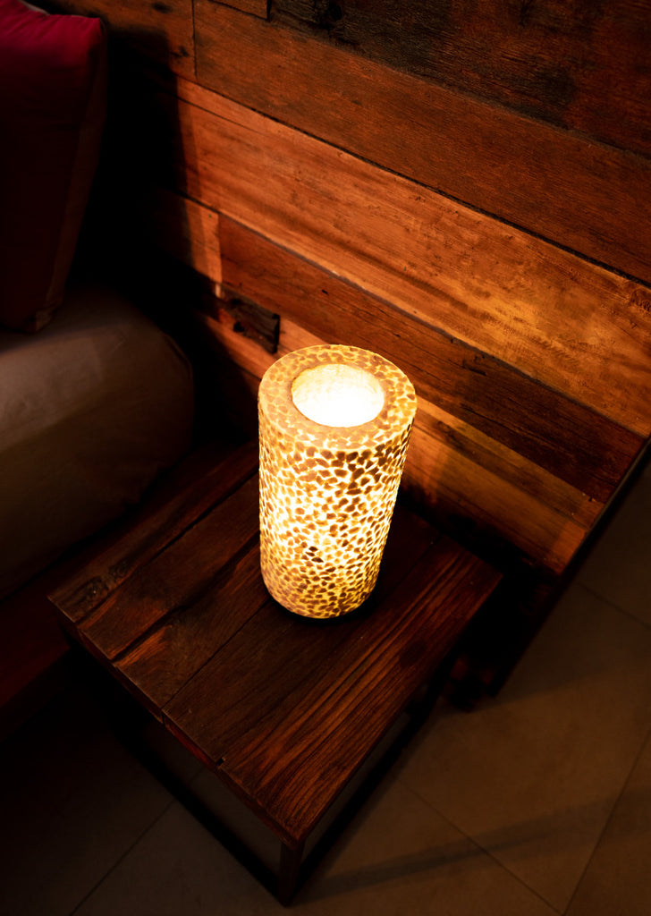 Handcrafted Mini Cylinder set of 2 is used as bedside table lamp on this picture next to a wooden bed in a bedroom